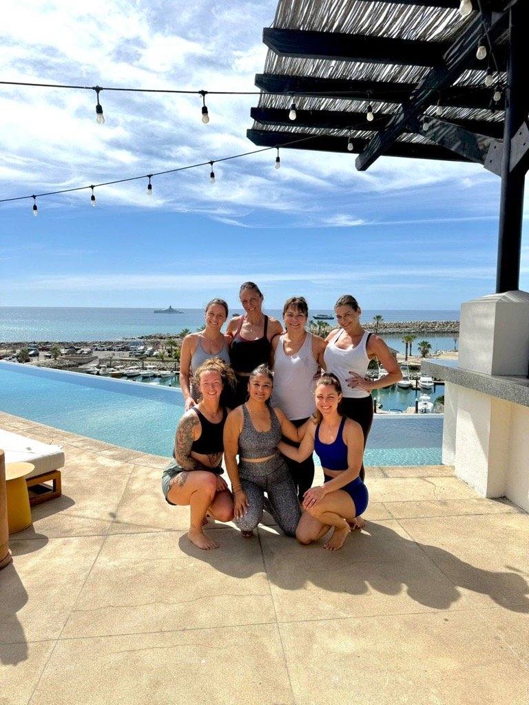 Retreat group at rooftop infinity pool