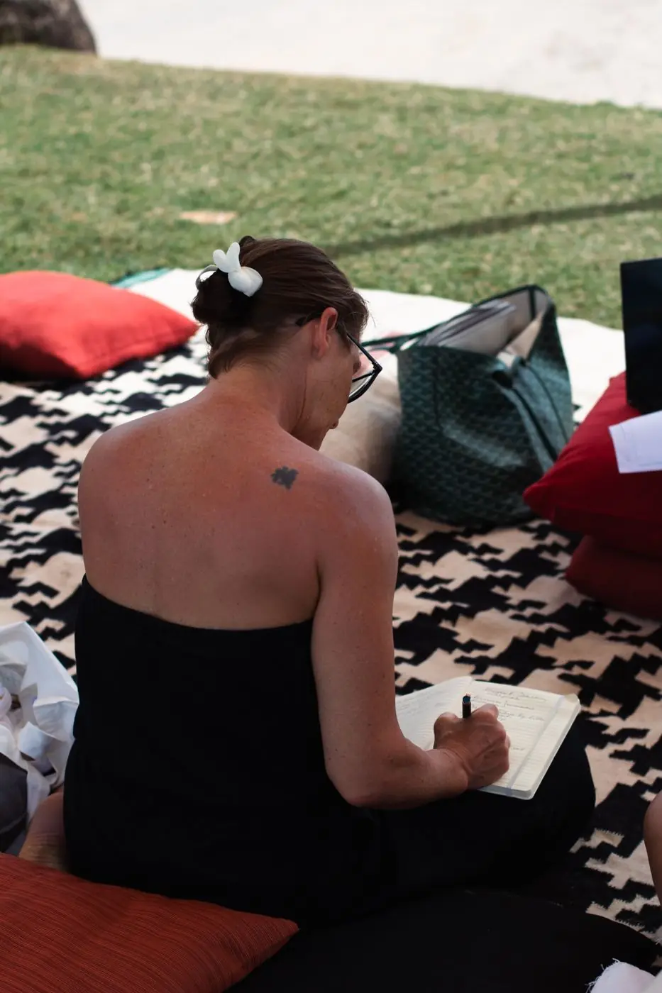 A guest journaling on the lawn