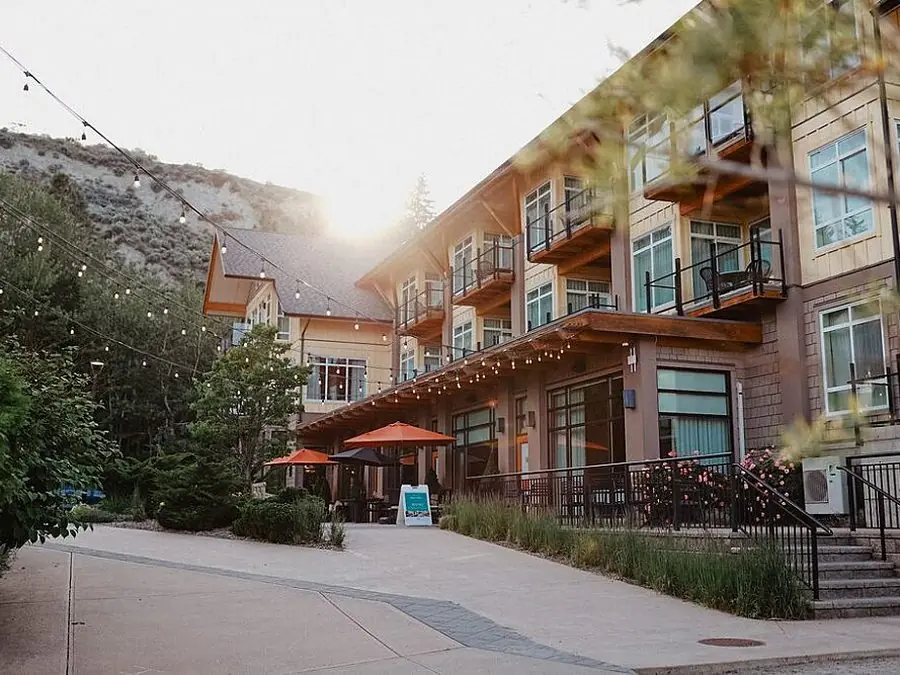 The resort entrance under string lights at golden hour